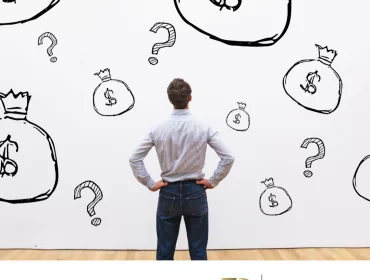 homem olhando uma parede com interrogações e sacos de dinheiro pensando quanto um advogado cobra para fazer um inventario em praia grande sp